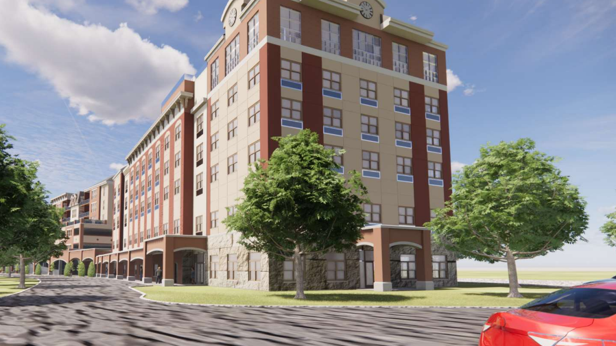 A rendering of the Bellefonte Waterfront Project’s second building, which would house commercial space, a parking garage and condominiums, as shown in the meeting presentation.