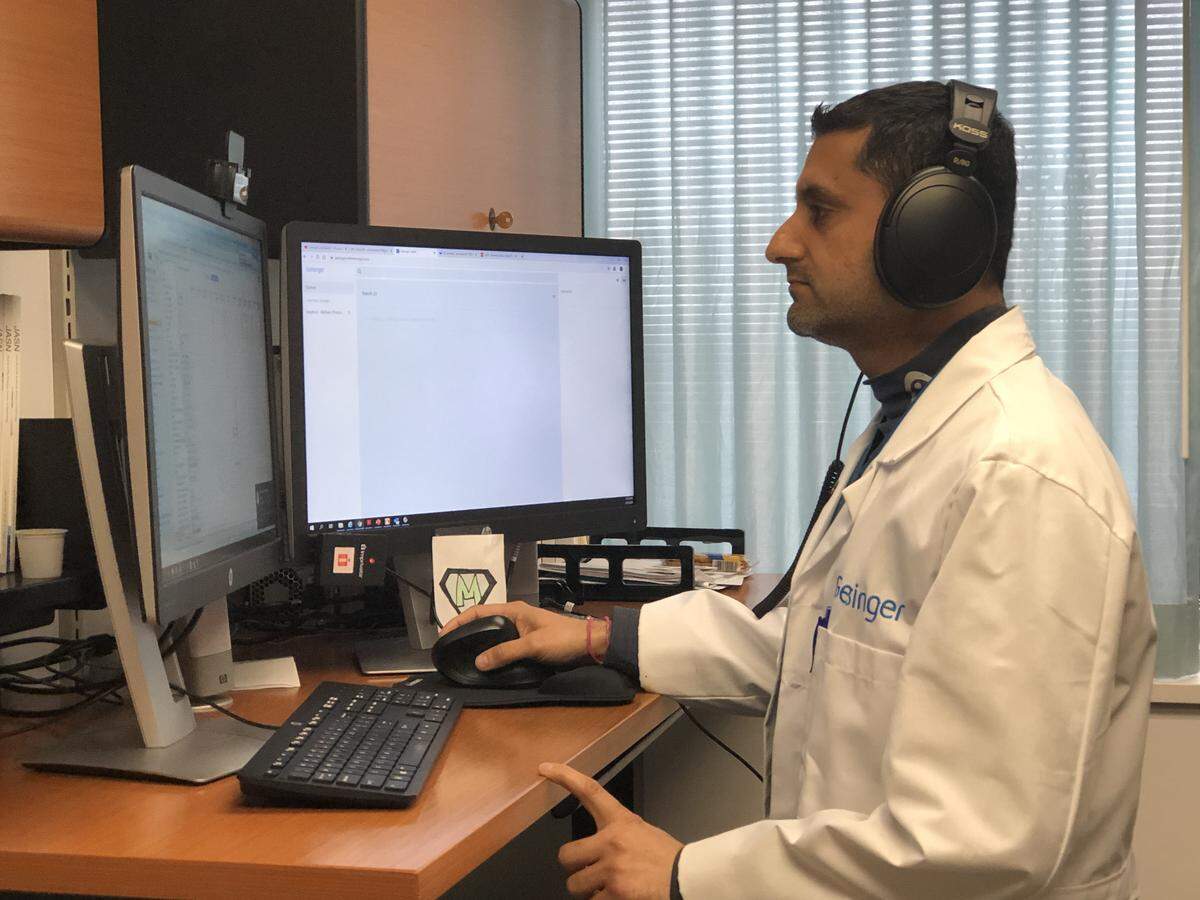 Geisinger nephrologist Dr. Prince Mohan prepares to connect with a patient through a telemedicine video visit. Geisinger expanded its telehealth services so patients can have continued access to primary and specialty care while slowing the spread of COVID-19.