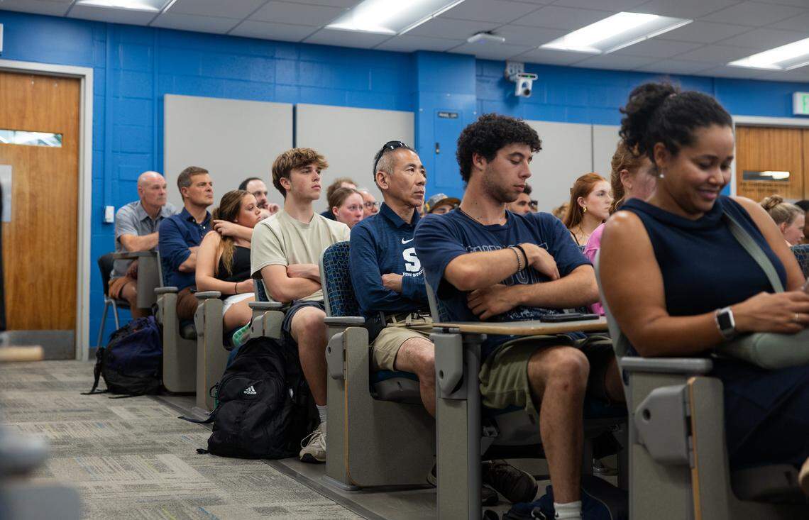 Attendees listen to panelists during a debate over whether college athletes should be paid in University Park, Pa., on Thursday, April 16, 2026. The debate was hosted by Penn State’s College of Health and Human Development.