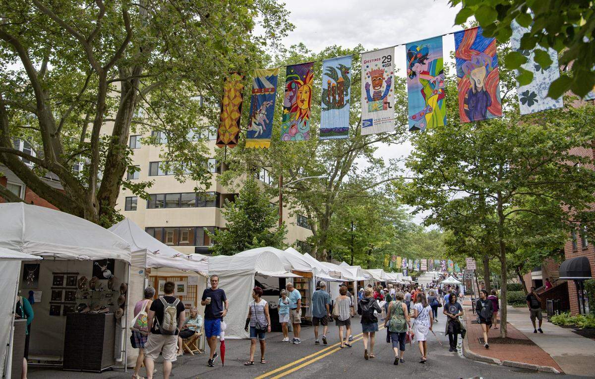 Visitors walk along the Sidewalk Ssale at the Central Pennsylvania Festival in 2019.