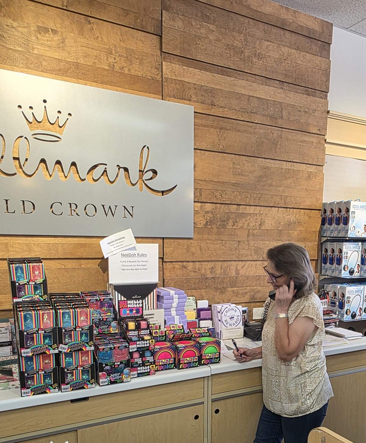Hallmark employee Mary Ann Sesler takes NeeDoh orders over the phone on Thursday, June 11, 2026.