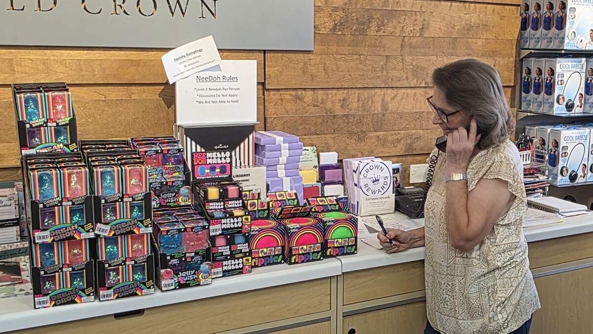 Hallmark employee Mary Ann Sesler takes NeeDoh orders over the phone on Thursday, June 11, 2026.