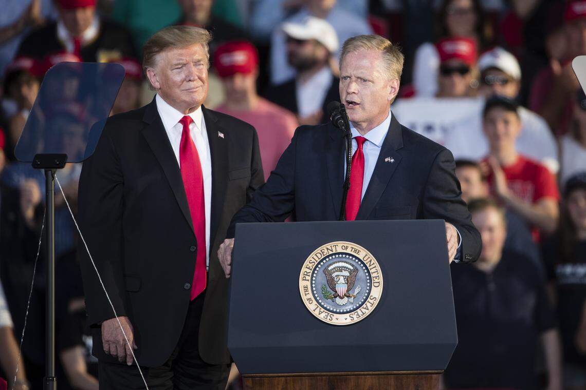Rep. Fred Keller, R-Snyder, right, speaks as President Donald Trump looks on during a campaign rally in Montoursville on Monday.
