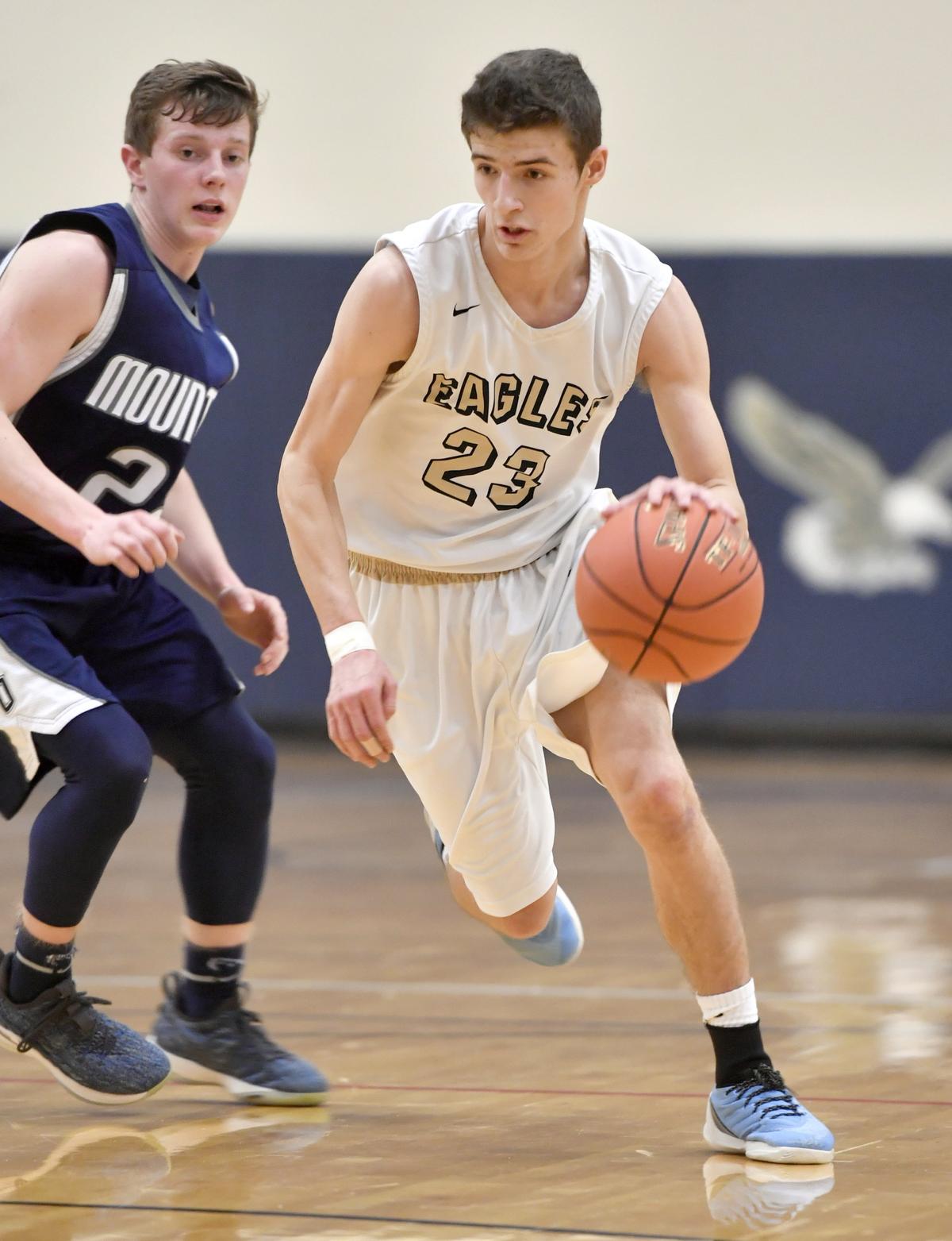 Bald Eagle Area’s Jaden Jones dribbles down the court ahead of a Philipsburg-Osceola defender during the game on Tuesday, Jan. 29, 2019.