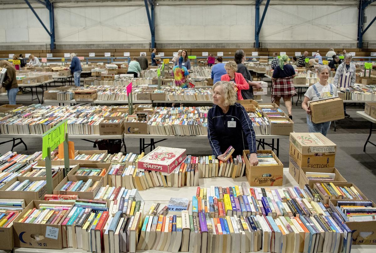 Volunteers set up the thousands of books on Thursday for the 2019 AAUW State College Used Book Sale.