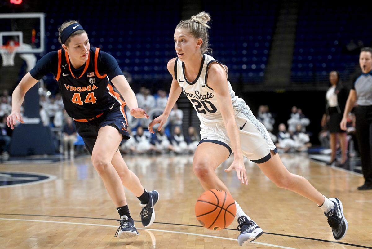 Penn State’s Makenna Marisa dribbles around Virginia’s McKenna Dale during the game on Wednesday, Nov. 30, 2022.
