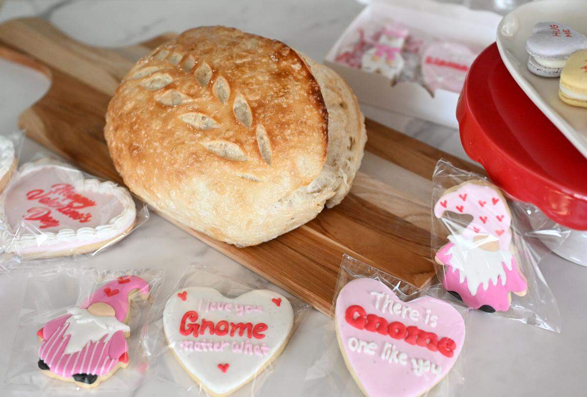 A sourdough bread loaf and a variety of Valentine’s Day cookies from Yilka’s Baking Studio.
