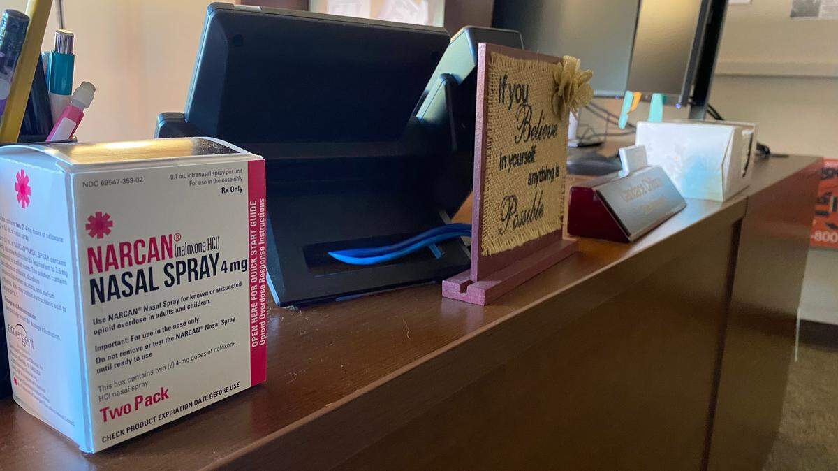 Sullivan County commissioners used a portion of opioid settlement money to hire a county case manager. Her desk includes a box of the opioid overdose-reversal drug Narcan.