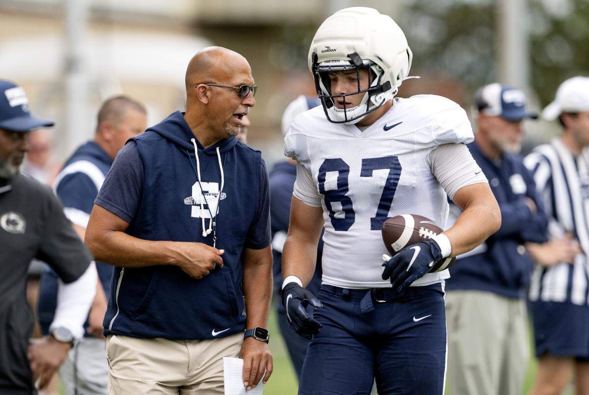 Penn State football coach James Franklin talks to tight end Andrew Rappleyea during practice on Tuesday, Aug. 19, 2025.  