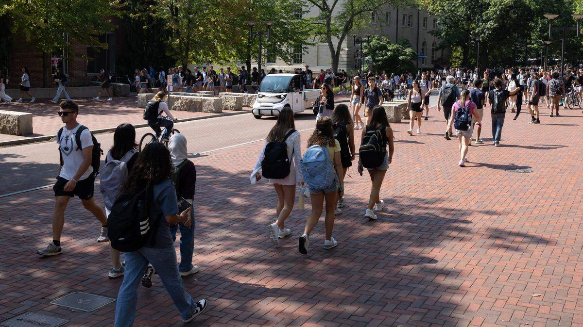 Penn State students walk through campus on the first day of classes on Monday, Aug. 26, 2024.