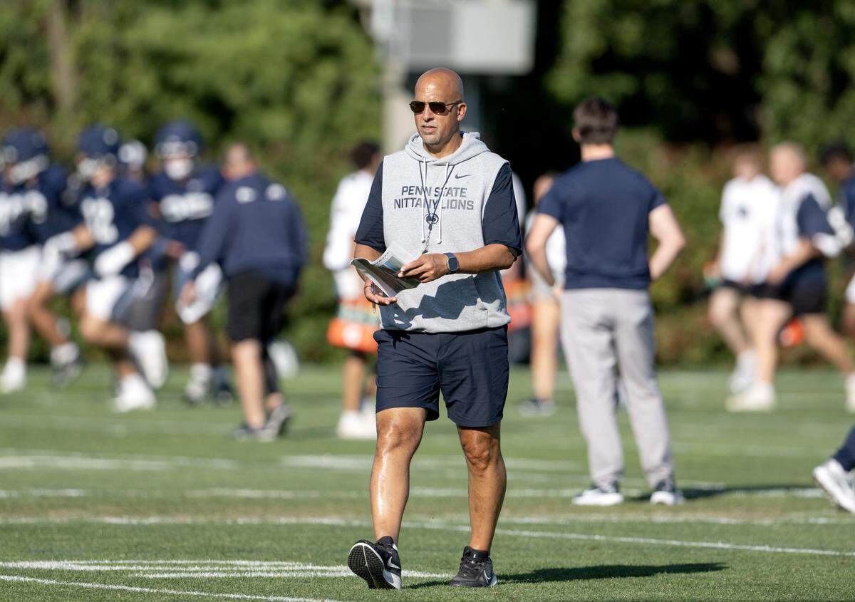 Penn State football coach James Franklin walks between the offense and defense during practice on Wednesday, Sept. 3, 2025.  