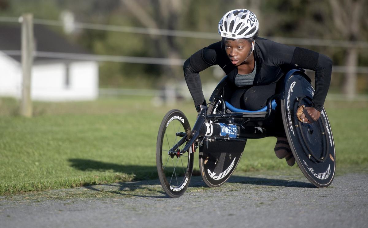 Michelle Wheeler concentrates as she goes up a hill in Boalsburg during her morning training session on Tuesday, Oct. 23, 2018.  “We work harder going up an up hill just because it’s all arms,” she said.