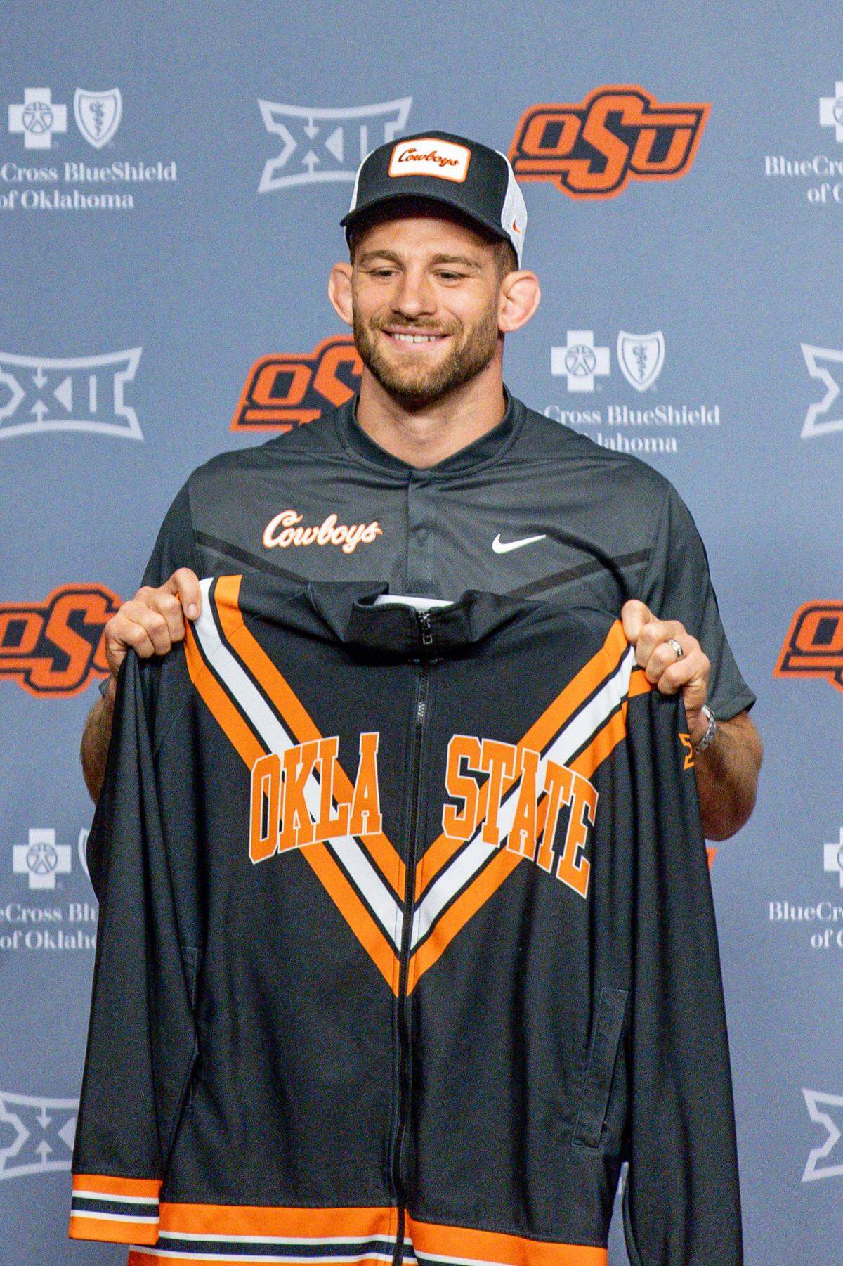 David Taylor poses during his introductory press conference in Stillwater, Oklahoma, at Boone Pickens Stadium. He is the Oklahoma State Cowboys’ new wrestling head coach.