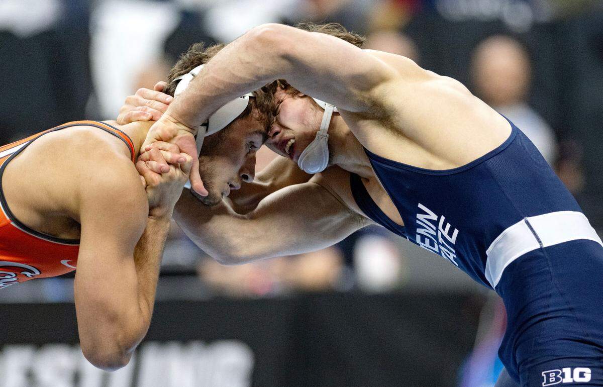 Oklahoma State’s Dean Hamiti and Penn State’s Levi Haines face off in a 174-pound semifinal bout at the 2025 NCAA Wrestling Championships in Philadelphia on Friday, March 21, 2025.