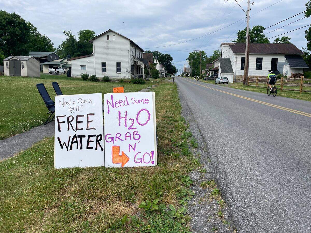 A hydration station on Jacksonville Road in the cycling portion of the course Sunday, June 14, 2026, at the Ironman 70.3 Pennsylvania Happy Valley North American Championship in Centre and Clinton counties.