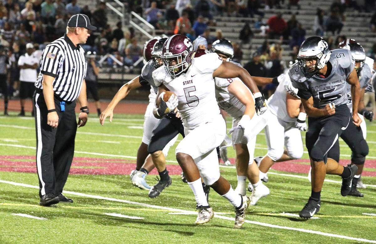 State College’s Isaiah Edwards runs down the field against Central Dauphin East on Friday. State College won 48-7.