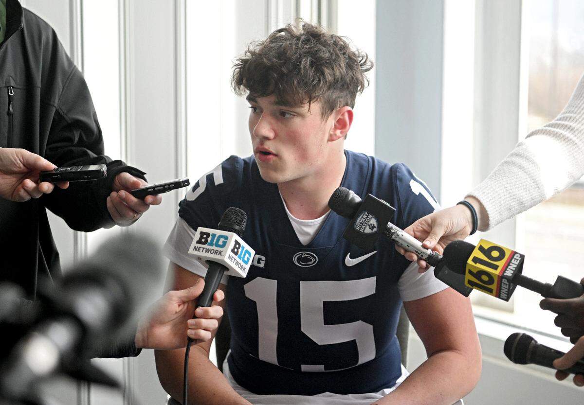 Microphones surround Penn State quarterback Drew Allar during a media availability on Tuesday, Feb. 7, 2023.