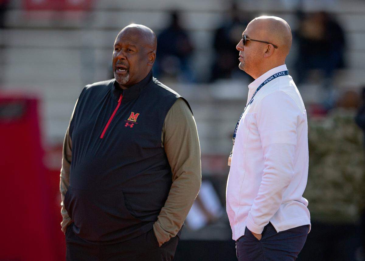 Maryland football coach Mike Locksley and Penn State football coach James Franklin chat before the game on Saturday, Nov. 6, 2021.