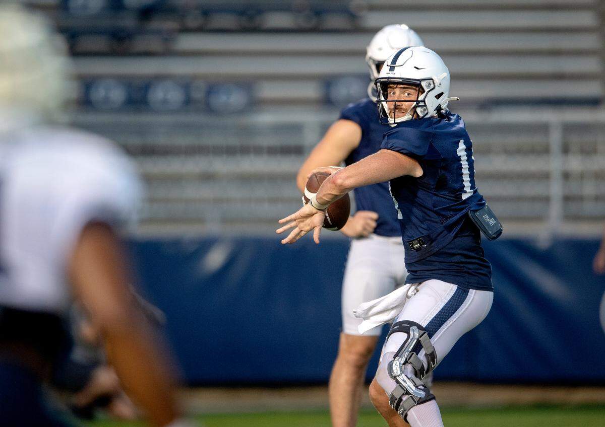 Penn State quarterback Sean Clifford makes a pass during practice on Wednesday, Aug. 25, 2021 in Beaver Stadium.