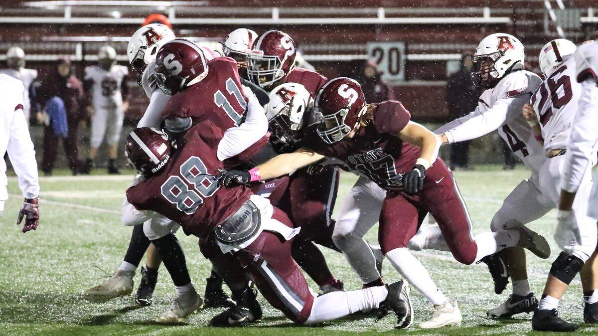 State College’s Stephen Scourtis (88), JW Scott (11) and the State College defense stop Altoona on Friday, Oct. 29, 2021, at Memorial Field. State College won, 21-7.