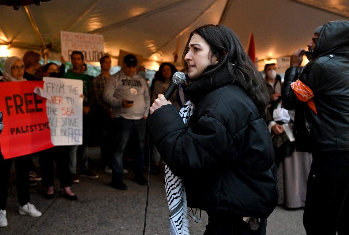 Roua Daas talks to the crowd gathered to support Palestine at the Allen Street gates on Thursday, Oct. 12, 2023.