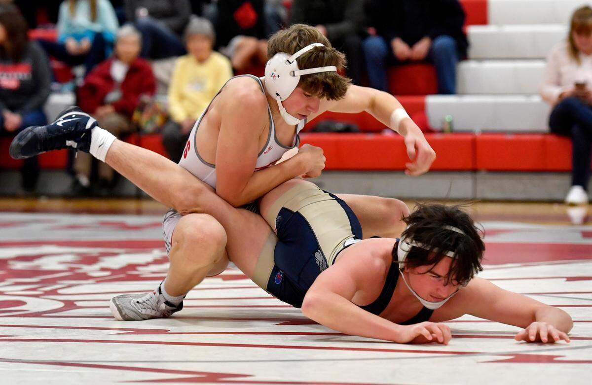 Bellefonte’s Gage Long flips Bald Eagle Area’s Tayten Yoder in the 145 lb bout of the match on Tuesday, Dec. 14, 2021. Long won by decision, 7-2.