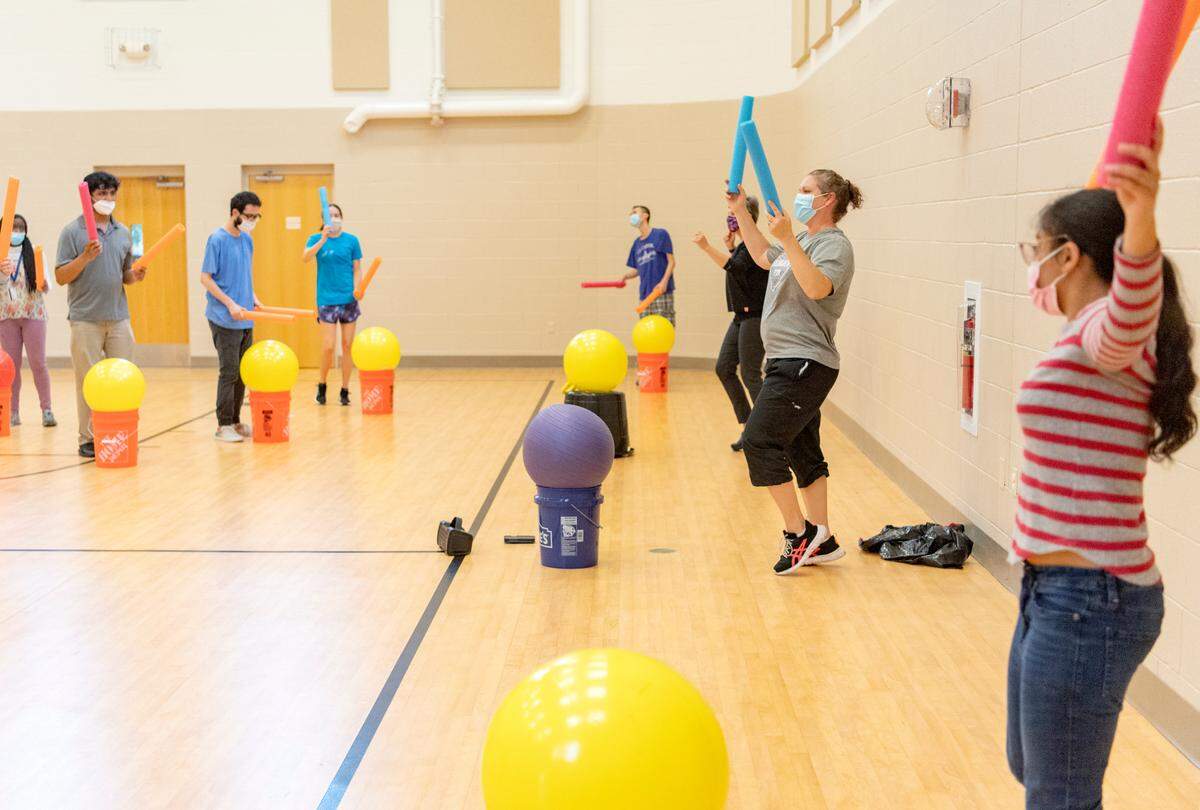 Jonna Belanger leads a Happy Valley FitLink cardio drumming class on Wednesday.