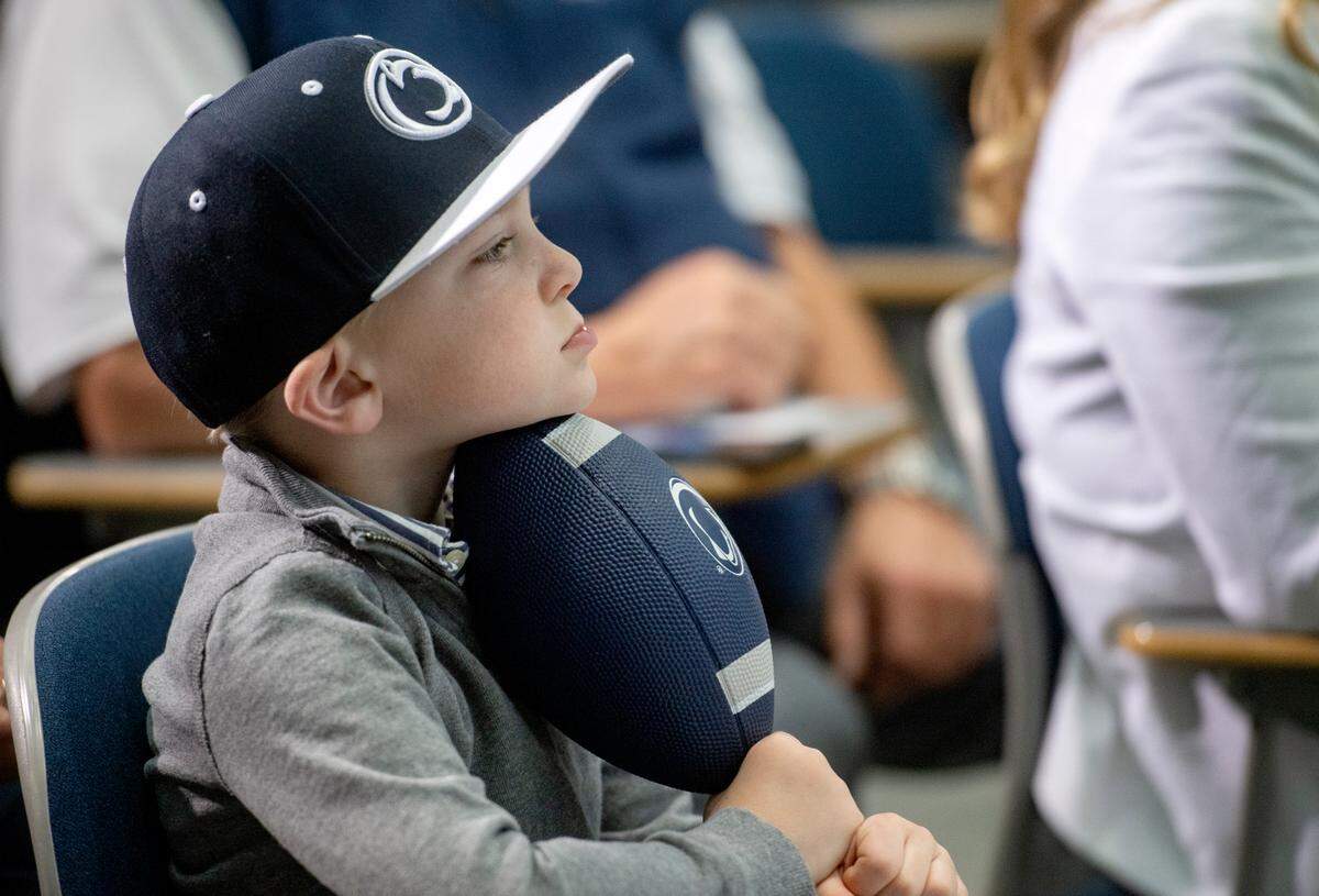 Joseph watches as his dad, Patrick Kraft, is introduced as the next Penn State athletic director on Friday.