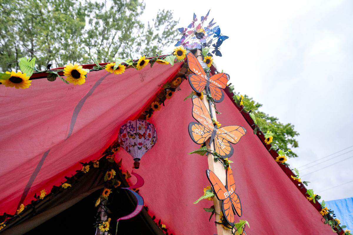 Sunflowers and monarch butterflies decorate a tent at the Centre County Grange Encampment and Fair.