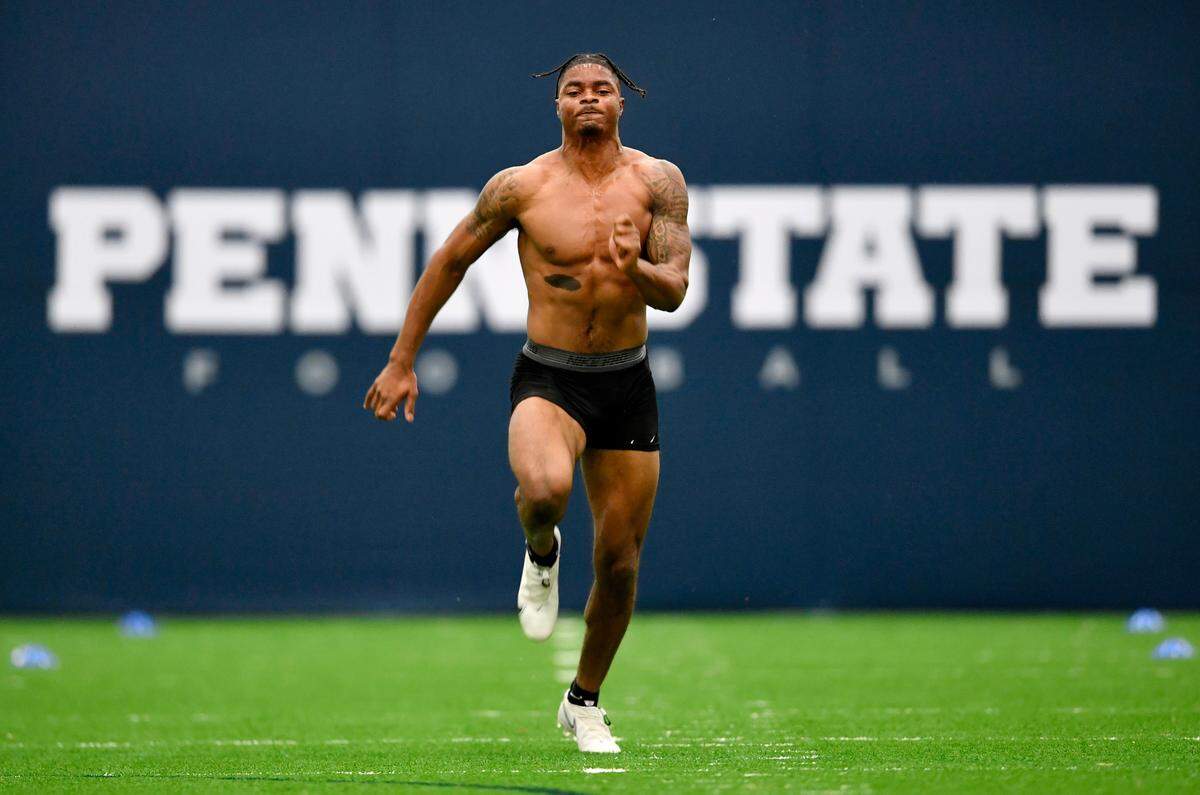 Safety Jaquan Brisker runs the 40-yard dash during Penn State Pro Day on Thursday.