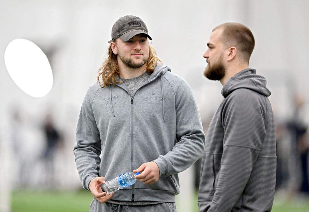 Tight end Tyler Warren talks with Pat Freiermuth during Penn State football’s pro day on Friday, March 28, 2025.