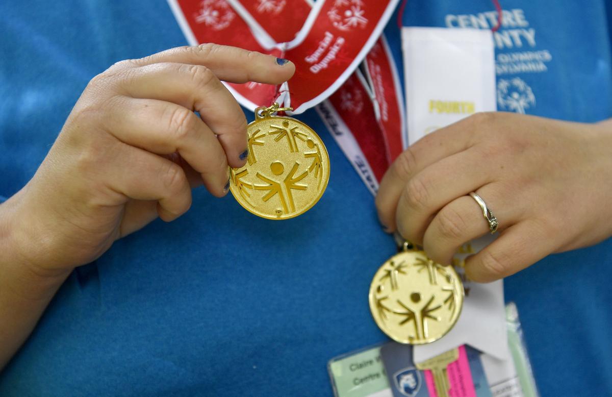 Centre County Special Olympics Claire Weaver shows off the medals she won from track and field and softball at the Special Olympics Pennsylvania summer games on Friday, June 7, 2019.