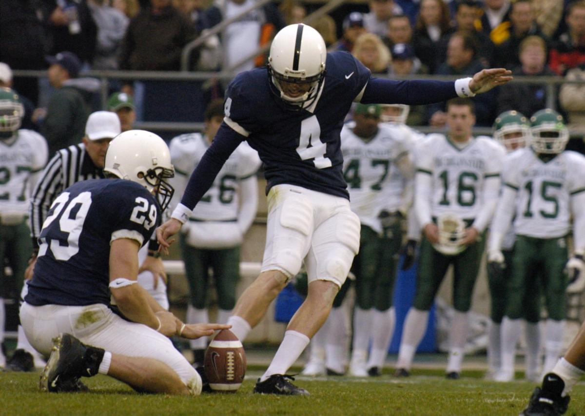 Robbie Gould kicks the ball as Paul Cronin holds.  PennState beat Michigan  State 37-13 November 20, 2004