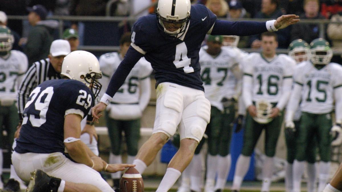 Robbie Gould kicks the ball as Paul Cronin holds. Penn State beat Michigan State 37-13 on Nov. 20, 2004.