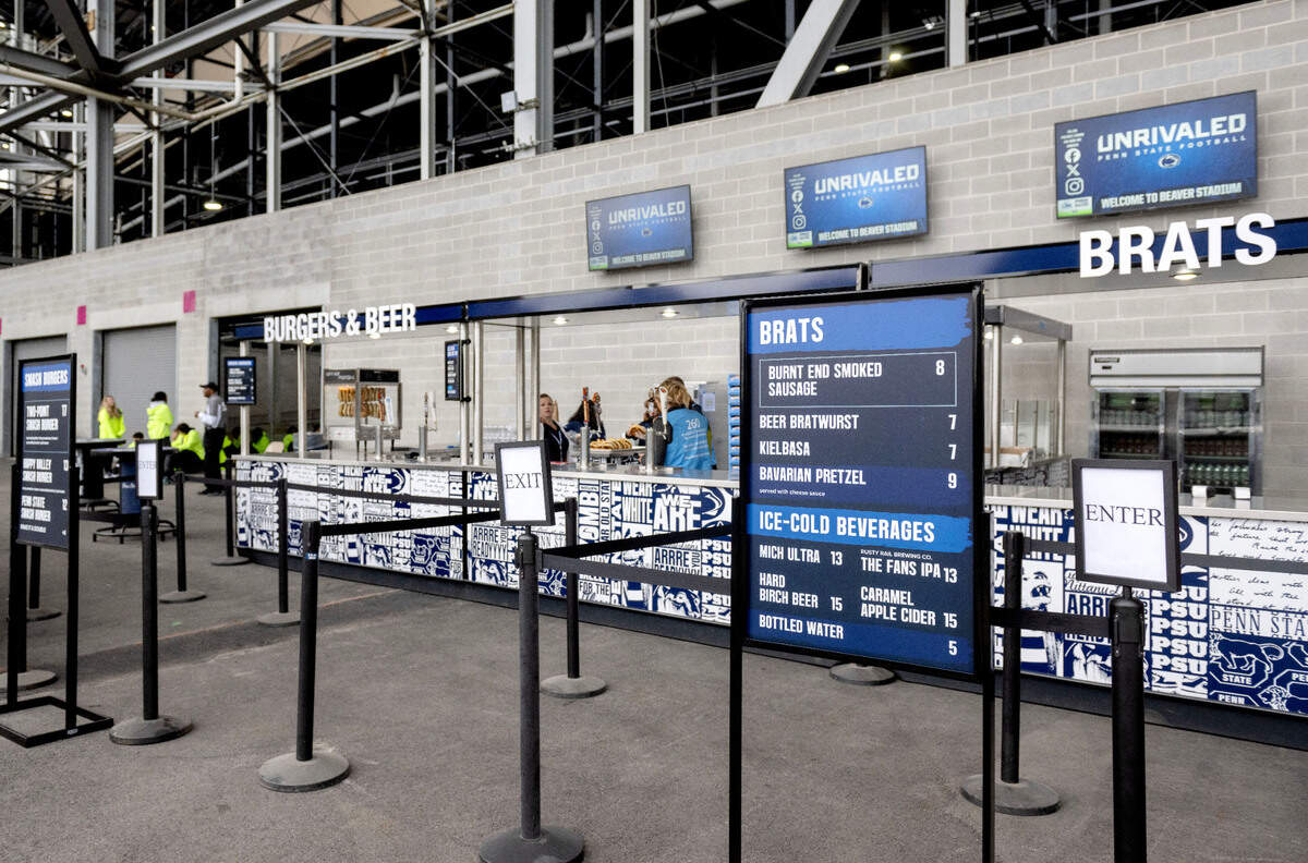 Burger and brat stands in the new Gate F lounge area at Beaver Stadium before the game against Bowling Green on Saturday, Sept. 7, 2024.