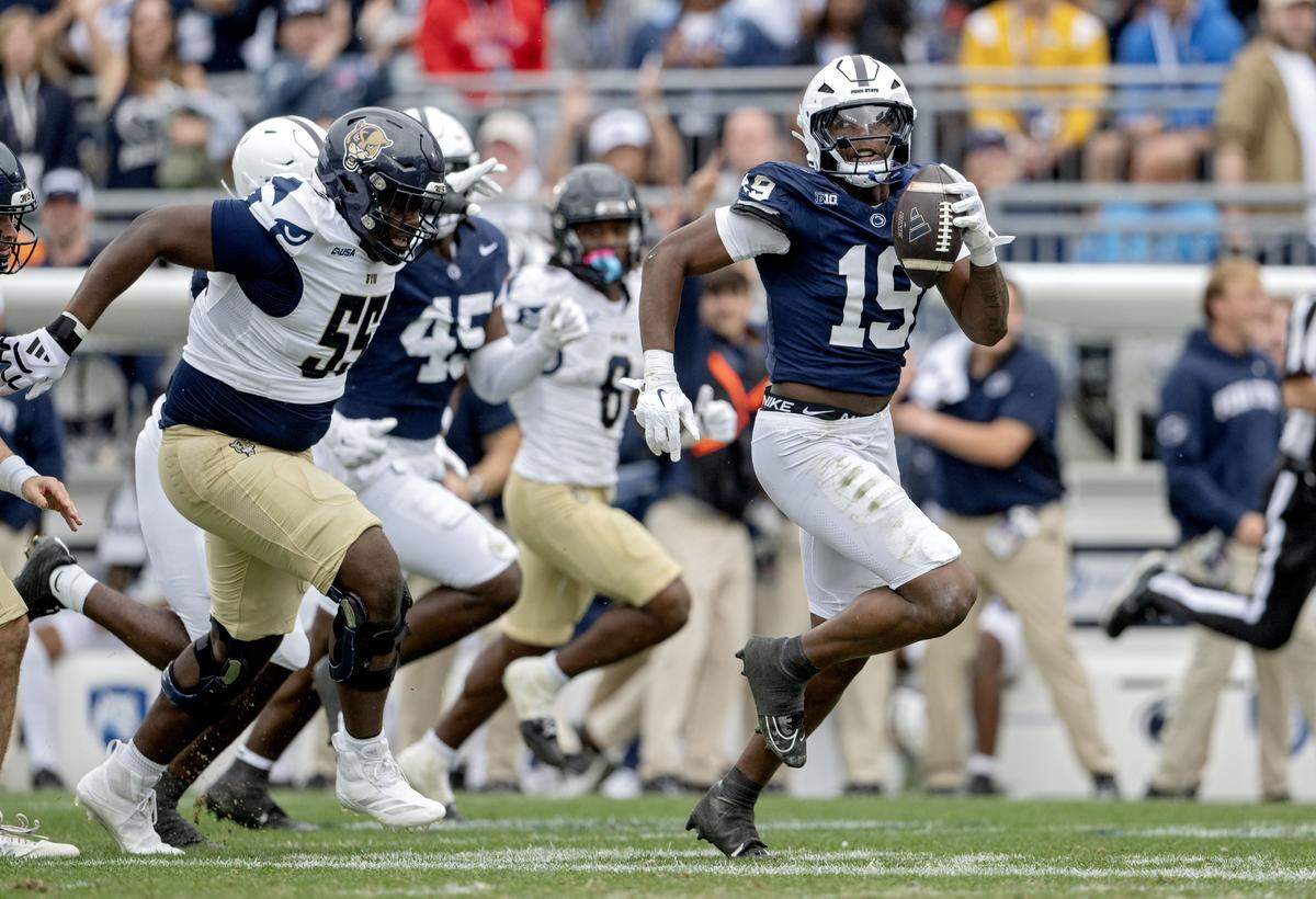 Penn State defensive end Chaz Coleman runs with the ball after knocking it away from FIU backup quarterback Joe Pesansky during the game on Saturday, Sept. 6, 2025 at Beaver Stadium.