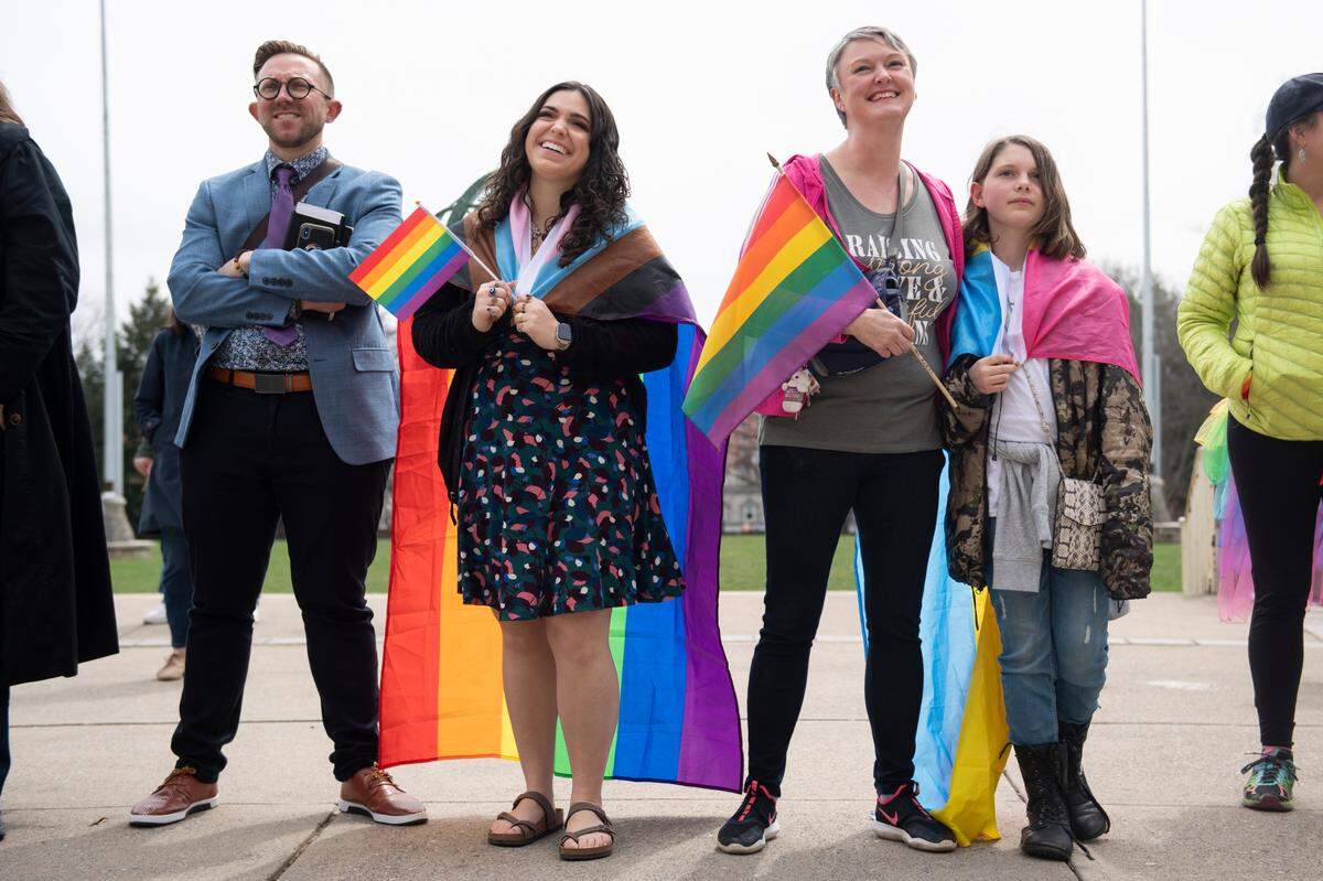 A crowd listens to speakers during a Pride event at Penn State’s Old Main on Monday.