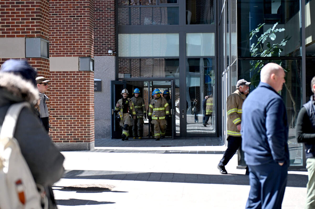 Firefighters walk out of the Benkovic Building on the Penn State campus after it was evacuated the morning of Wednesday, April 8, 2026, after a fire reportedly started in Room 219.