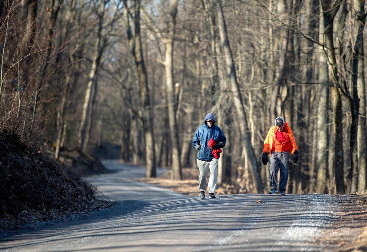 Jay Maynard runs with George Etzweiler down Laurel Run Road after going a mile and half up for their workout on Thursday, March 5, 2020. The incline of the road helps Etzweiler train for the Mountain Washington Road Race.