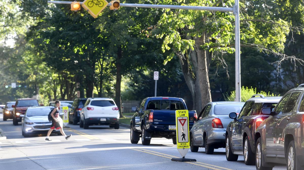 Traffic stops for pedestrians crossing at McKee Street and East Park Avenue on Wednesday, Sept. 5, 2018. Starting Monday, travel restrictions will be in place while a pedestrian island is installed at the intersection.