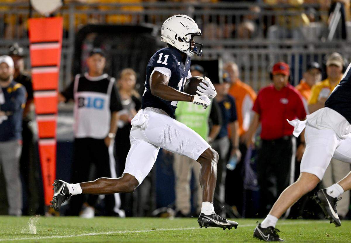 Penn State wide receiver Malik McClain makes a catch and runs it in for a touchdown during the game against West Virginia on Saturday, Sept. 2, 2023.