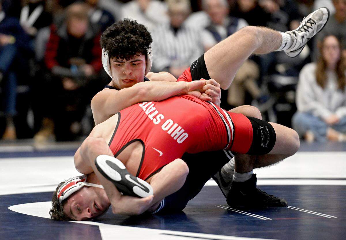 Penn State’s Beau Bartlett controls Ohio State’s Jesse Mendez in overtime of the 141 lb bout during the match on Friday, Feb. 2, 2024 in Rec Hall.