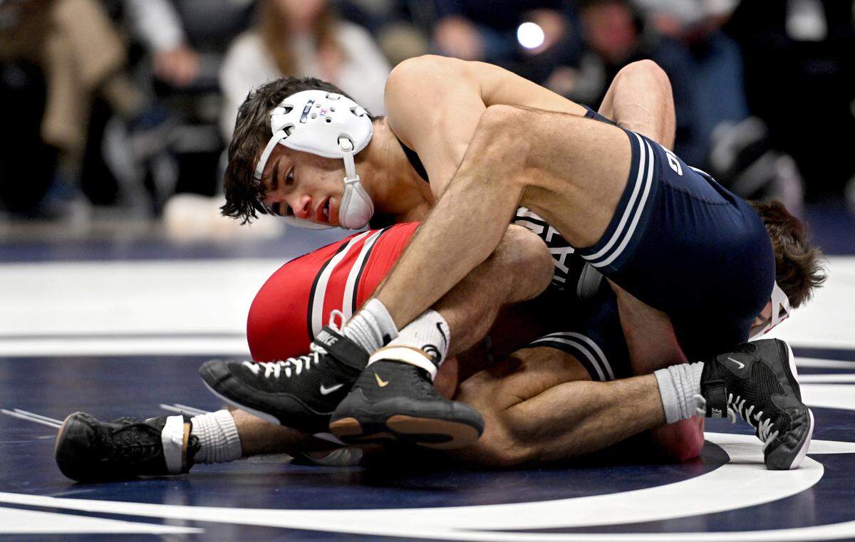 Penn State’s Aaron Nagao controls Ohio State’s Nic Bouzakis in the 133 lb bout during the match on Friday, Feb. 2, 2024 in Rec Hall.