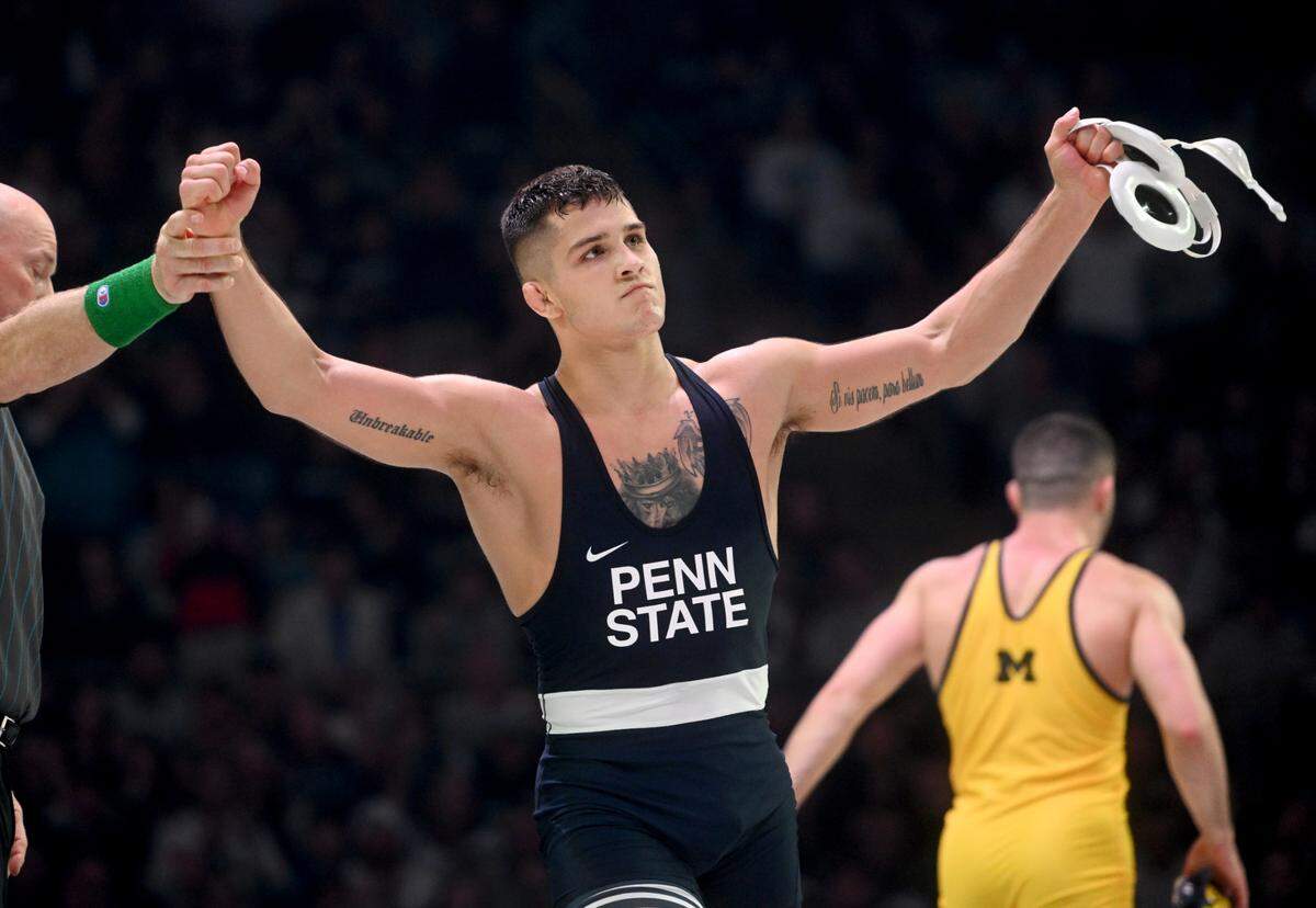 Penn State’s Alex Facundo celebrates his ultimate tiebreaker with riding time win over Michigan’s Cameron Amine in the 165 lb bout of the match on Friday, Jan. 20, 2023 at the Bryce Jordan Center.