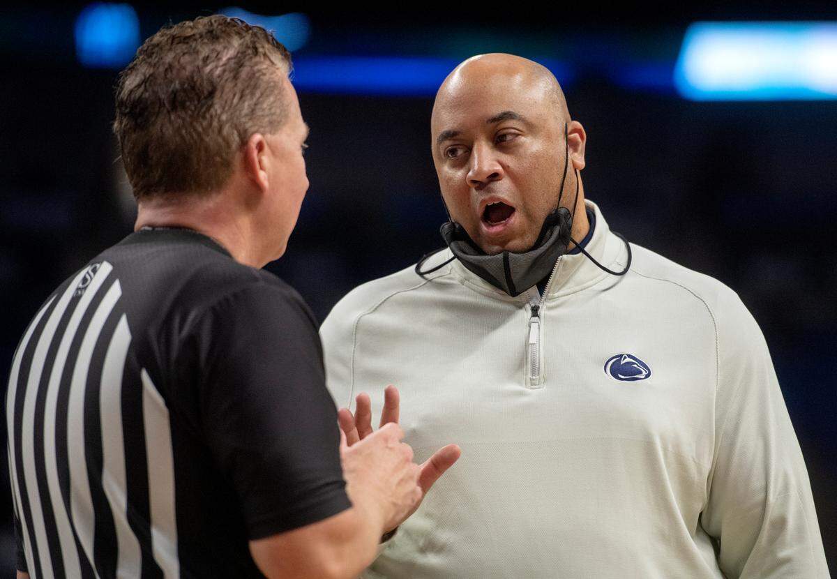 Penn State men’s basketball coach Micah Shrewsberry talks to the ref after a call during the game against Michigan State on Tuesday, Feb. 15, 2022.