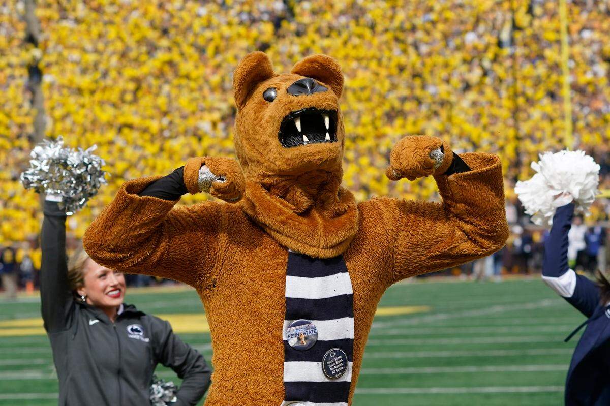 The Penn State mascot The Nittany Lion cheers in the first half of an NCAA college football game against Michigan in Ann Arbor, Mich., Saturday, Oct. 15, 2022. (AP Photo/Paul Sancya)