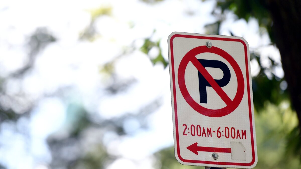 A view of a no parking between 2-6 a.m. sign in the Highlands neighborhood in downtown State College Thursday, Aug. 23, 2018.