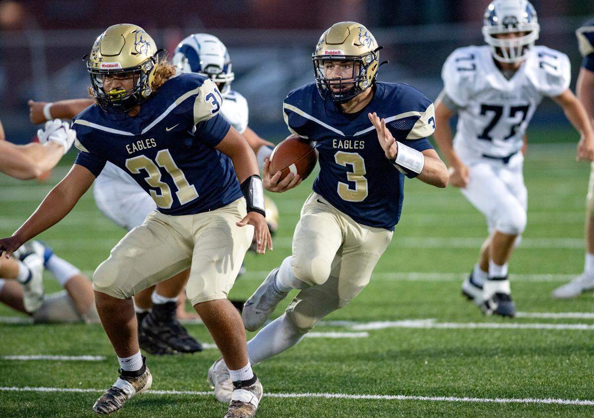 Bald Eagle Area’s Garrett Burns cuts down the field with the ball from Penns Valley defenders during the game on Friday, Sept. 24, 2021.