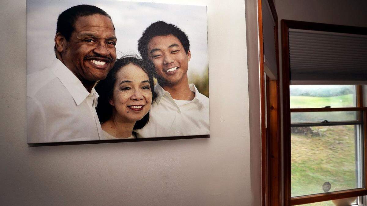 A family photo hangs on a wall in the dining room of Fe and Gareth Hall’s home in Stroudsburg.