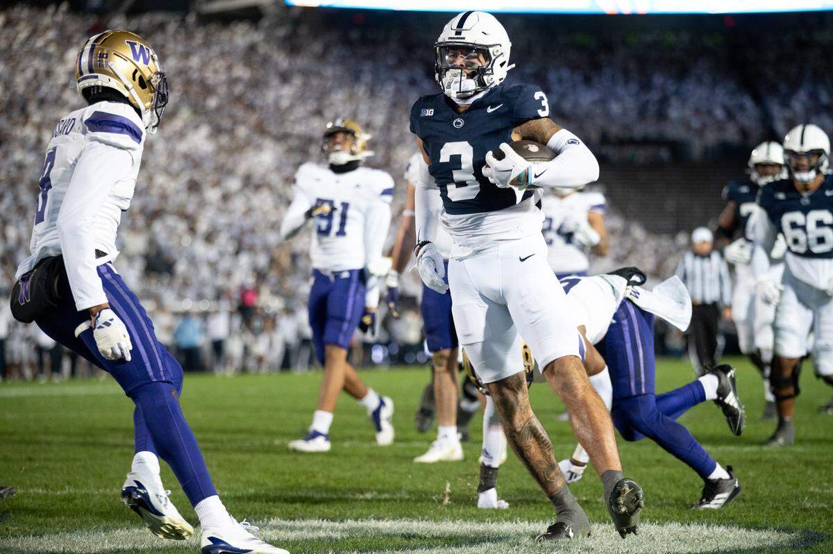 Penn State wide receiver Julian Fleming runs the ball into the end zone after making a catch during the football game at Beaver Stadium on Nov. 9.
